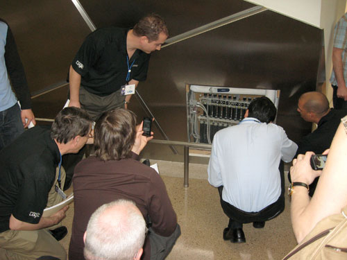 Radiant Cooling Engineering Summit attendees inspect a manifold wall cabinet during their tour of the Crystals at CityCenter in Las Vegas.