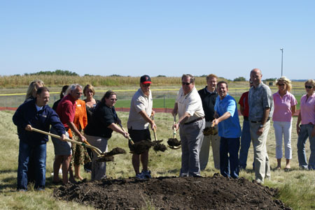 Uponor’s Richard Peick (right) digs in at the South Metro Miracle League Groundbreaking Ceremony on Sept. 12, 2010.