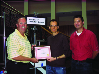 Uponor’s Jayson Drake & Eric Skare accept a 10-year anniversary plaque