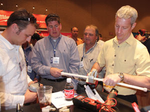 Uponor Convention attendees check out the M12 Cordless Shear Tool (right) and the M12 ProPEX Expansion Tool