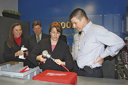 Senator Amy Klobuchar (D-Minn.) makes a ProPEX connection during a Jan. 11 visit to Uponor